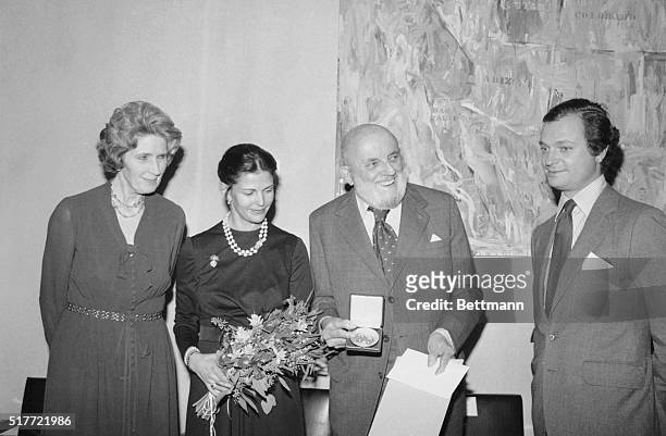 Photographer Ansel Adams holds the Hasselblad Award and the Erna and Victor Hasselblad Gold Medal presented to him by Sweden's King Carl XVI Gustaf...
