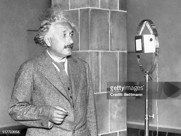 Einstein congratulating the inventor of electric light...Professor Albert Einstein, famous German scientist, is seen above as he congratulated Thomas...