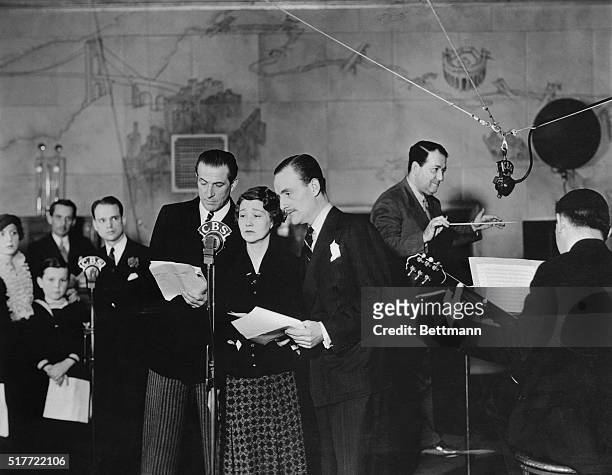 Fay Bainter shown during a dramatic moment during the Wards Family Theater broadcast at CBS is photographed here. With her are Fred Worlock, and John...