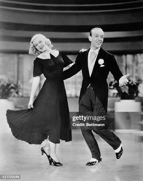 Ginger Rogers plays Penelope "Penny" Carroll and Fred Astaire plays John "Lucky" Garnett in the musical number "Pick Yourself Up" in the 1936 film...