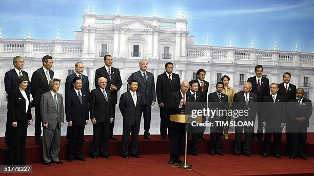 Chilean President Ricardo Lagos delivers a speech as other leaders of the Asia-Pacific Economic Cooperation look on during the summit's closing...