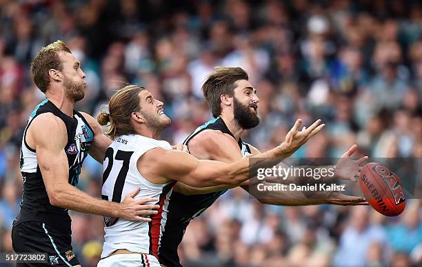 Justin Westhoff of the Power and Josh Bruce of the Saints attempt to mark the ball during the round one AFL match between the Port Adelaide Power and...