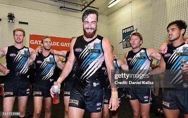 Charlie Dixon of the Power receives a Gatorade shower as the players sing the club song after the round one AFL match between the Port Adelaide Power...
