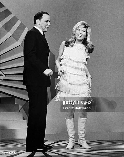 Frank Sinatra and his daughter, Nancy Sinatra, perform on the television special "A Man and His Music." Nancy's trademark song was "These Boots Are...