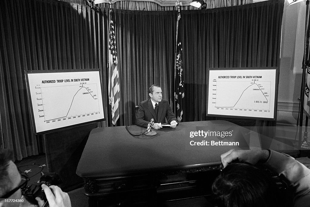 President Nixon Flanked By Charts