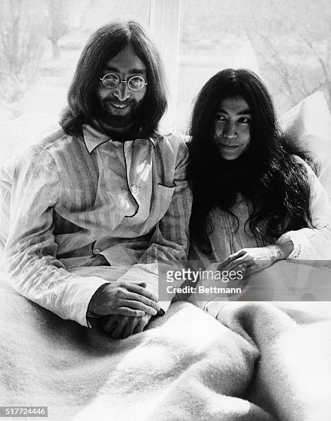 Beatle John Lennon and his new wife, Yoko Ono, in bed during a press conference at the Amsterdam Hilton Hotel. They told the press that they would...
