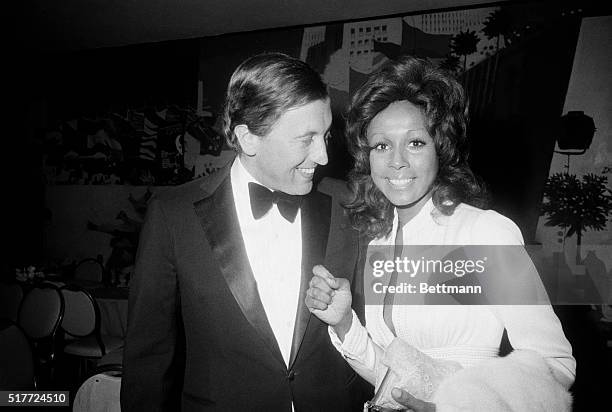 Television talk show host David Frost smiles at actress Diahann Carroll as they attend the Albert Einstein Commemorative Dinner at the Hotel Hilton....