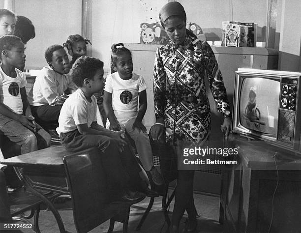 New York children in a pre-school day camp watch the educational TV program 'Sesame Street' as part of an experiment to prepare them for public...