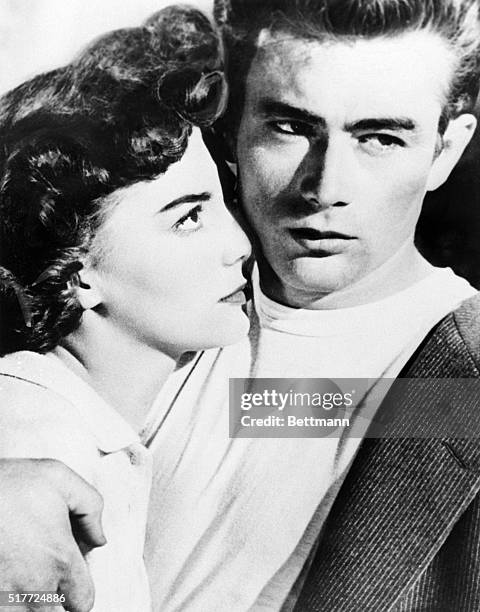 Publicity photograph of James Dean and Natalie Wood in a scene from the movie "Rebel Without a Cause." Movie still.