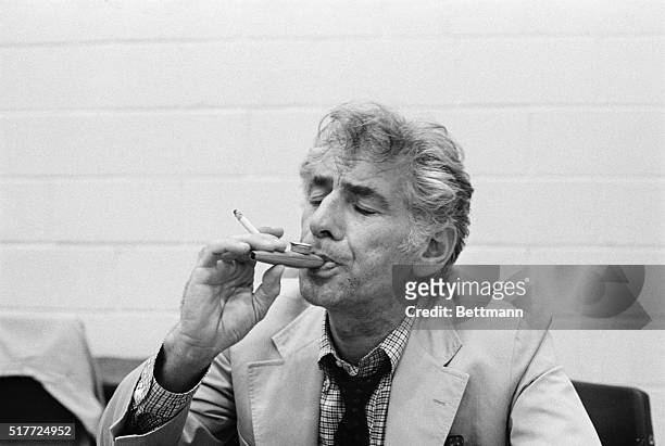 Conductor Leonard Bernstein plays a kazoo during a rehearsal of "Mass" at the John F. Kennedy Center for the Performing Arts. A scene from "Mass,"...
