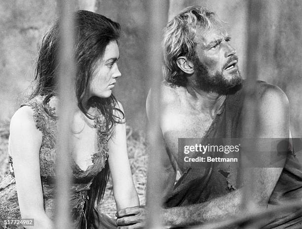 Charlton Heston and Linda Harrison appear together in the film Planet of the Apesin 1968.