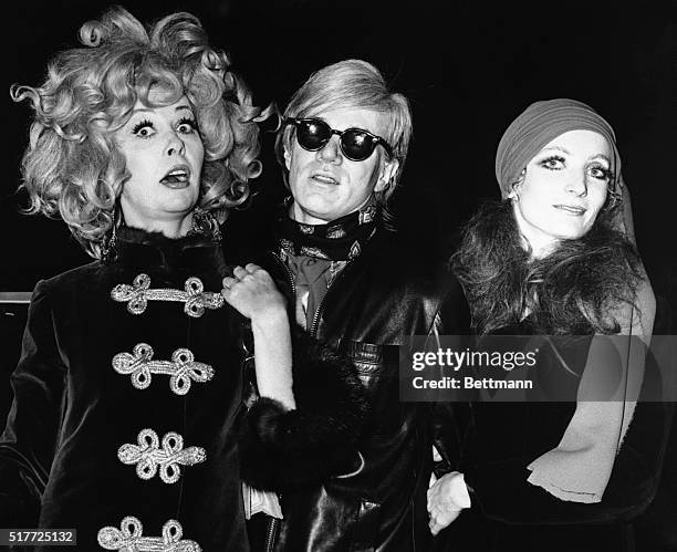 Ultra Violet; Andy Warhol, and unidentified friend arrive at the Trans-Lux Theater for the premiere of "I Love You, Alice B. Toklas!" 10/7/1968 BPA...