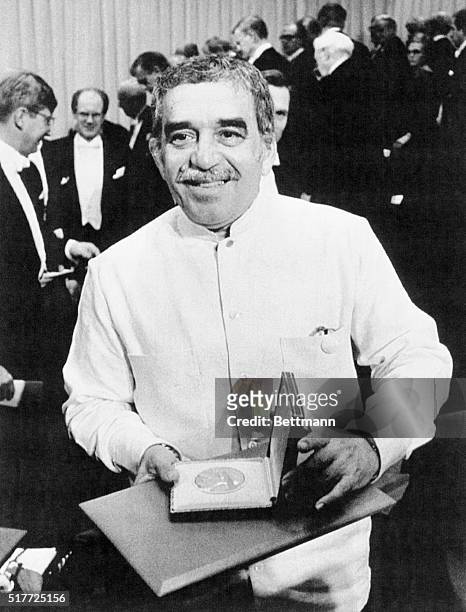 Writer Gabriel Garcia Marquez holding his Nobel Prize for Literature medal after the award ceremony in Stockholm, Sweden.