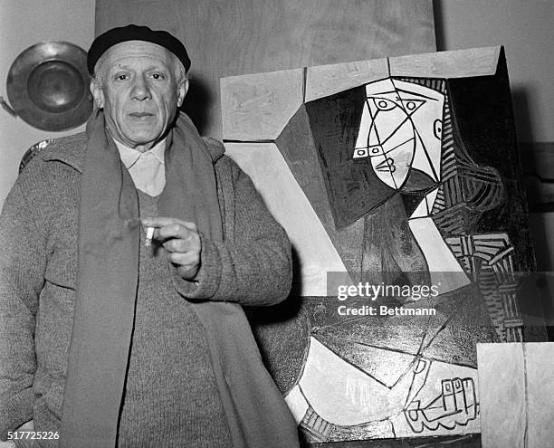 Artist Pablo Picasso with one of his latest works in Vallauris, France, where he is preparing for summer exhibitions.