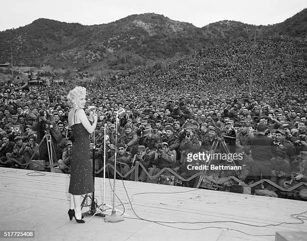 Korea: The power of a woman. Over 10,000 GI's turn out to hear and see Marilyn Monroe as the bosomy blonde makes an appearance in Korea, February...