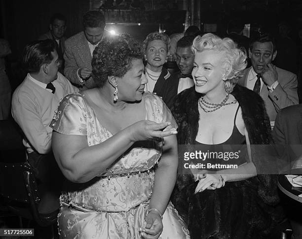 Hollywood, CA: Marilyn meets Ella. Looking fit and well-groomed after her recent hospitalization, actress Marilyn Monroe attends a jazz session at...