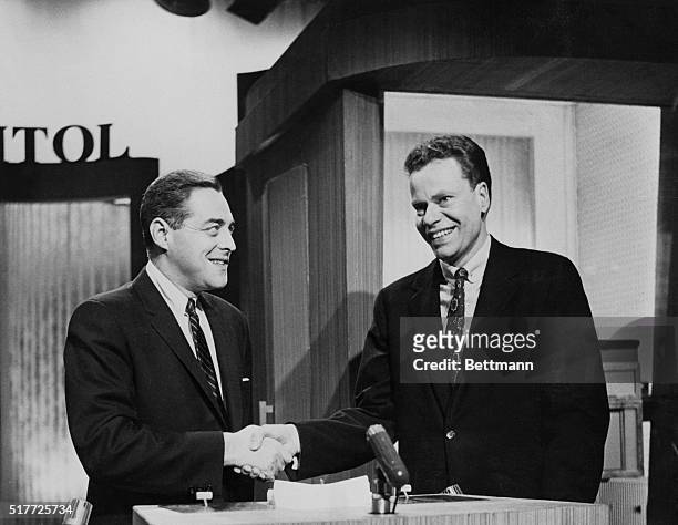 New York, NY: Charles Van Doren , an instructor at Culumbia University, gets a handshake from quizmaster Jack Barry on the "Twenty One" NBC TV show...