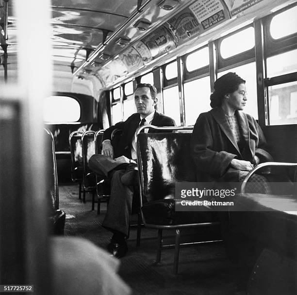 American civil rights activist Rosa Parks sits in the front of a bus in Montgomery, Alabama, after the Supreme Court ruled segregation illegal on the...