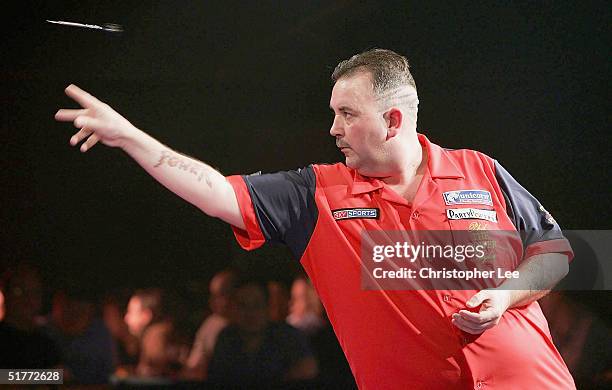 Phil Taylor in action during the Showdown match between Phil Taylor and Andy Fordham at The Circus Tavern on November 21, 2004 in Purfleet, England.