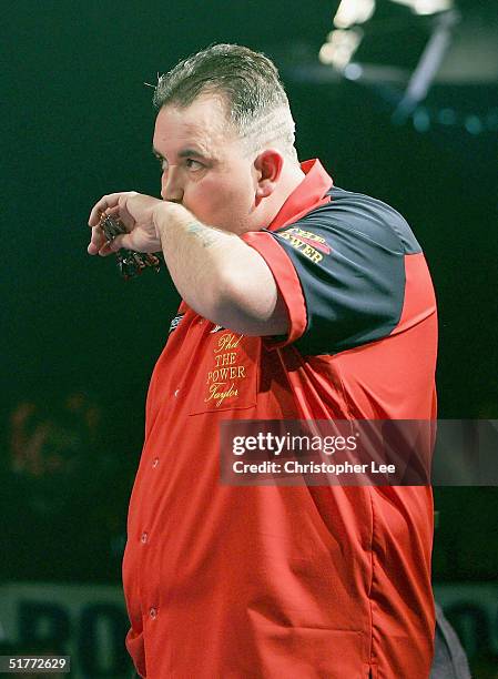 Phil Taylor looks dejected during the Showdown match between Phil Taylor and Andy Fordham at The Circus Tavern on November 21, 2004 in Purfleet,...