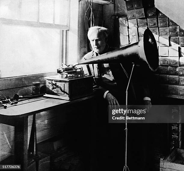 Thomas Edison with his first phonograph. Photograph.