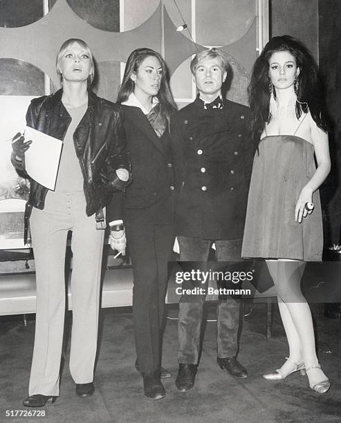 Andy Warhol escorts his female entourage to the Manhattan premiere of Blowup on December 19, 1966. Standing from left: Nico, Mary Woronov, Andy...