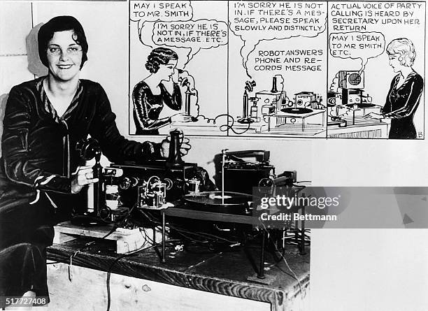 Los Angeles, CA- Portrait of Mrs. Thelma Ron demonstrating the "mechanical secretary," a machine invented by E.R. Degenhart to handle telephone calls...