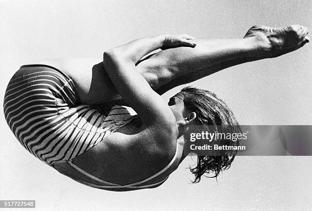 Helsinki, Finland- OLYMPICS GAMES. Mrs. Patricia McCormick of Los Angeles, CA, shows off her championship form as she executes a difficult manuever...