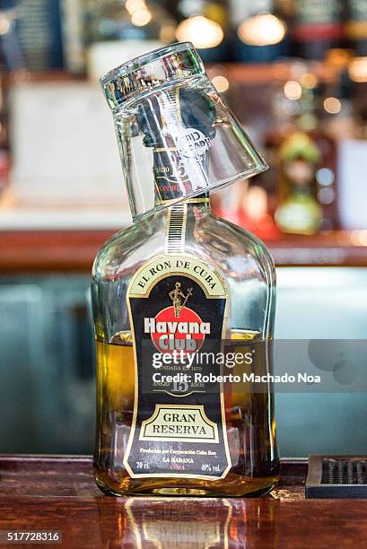 Havana Club 15 year old rum bottle at bar counter.