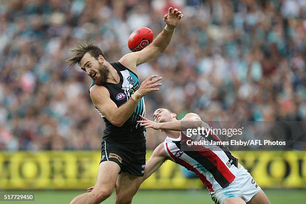 Charlie Dixon of the Power clashes with Dylan Roberton of the Saints during the 2016 AFL Round 01 match between Port Adelaide Power and the St Kilda...