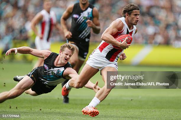 Tom Jonas of the Power tackles Maverick Weller of the Saints during the 2016 AFL Round 01 match between Port Adelaide Power and the St Kilda Saints...