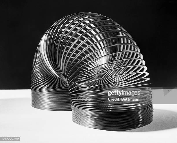 Photo shows the "Slinky," a toy invented by Civil Engineer Richard R. James of Philadelphia after he watched a steel spring roll off a war plant...