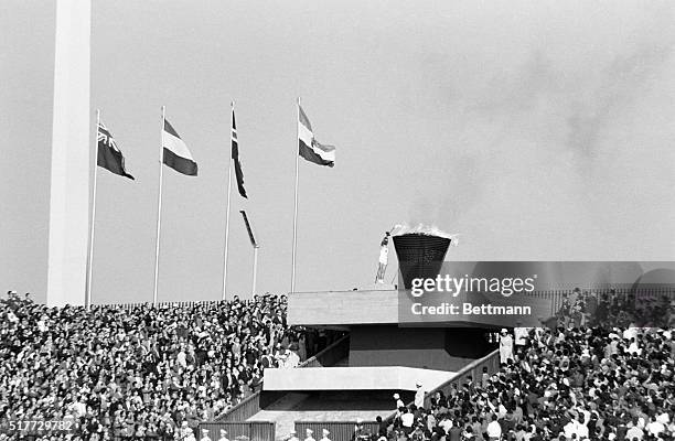 Tokyo, Japan- Japanese Yoshinori Sakai is shown lighting the Olympic Flame at National Stadium.