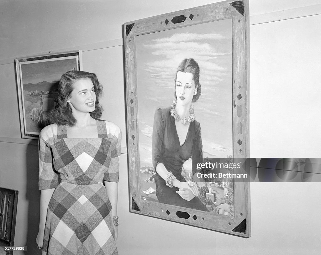 Gloria Vanderbilt Standing Behind hers Portrait