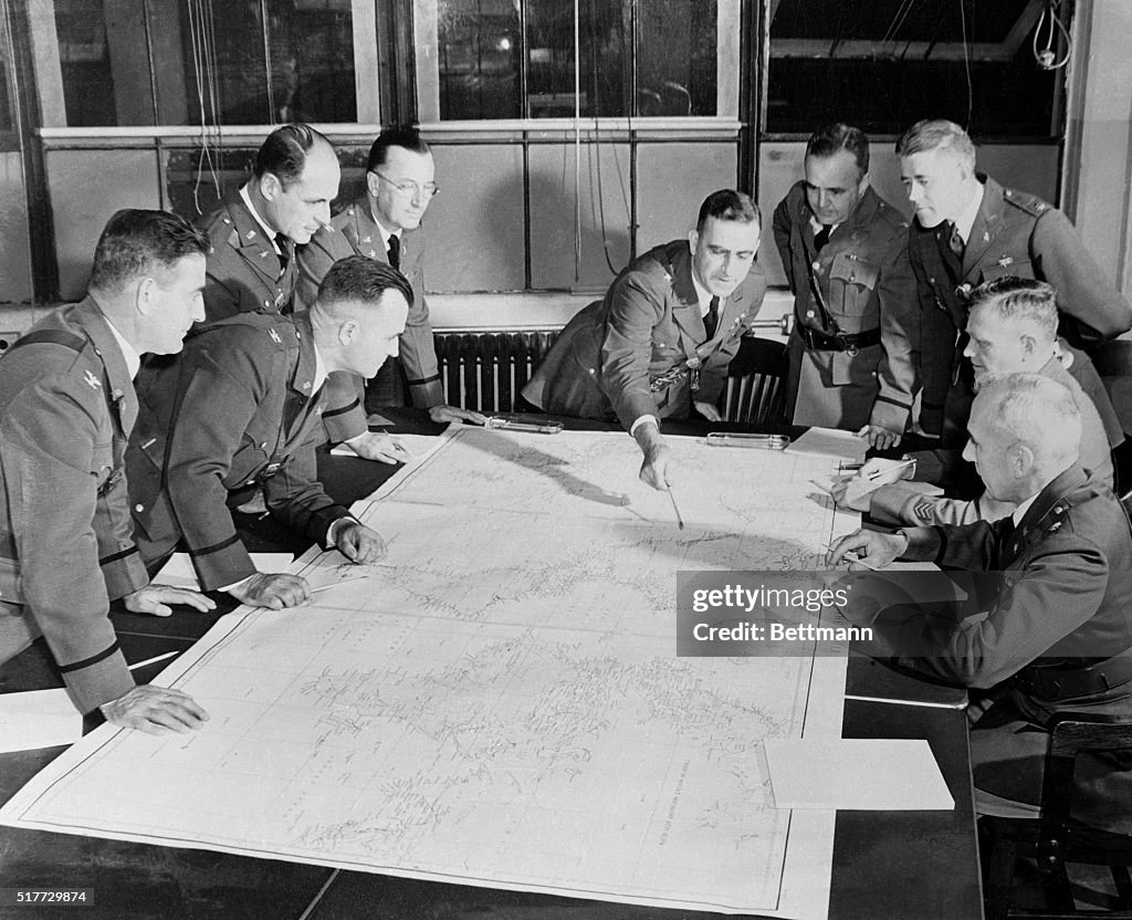 War Generals Discussing Strategic Map