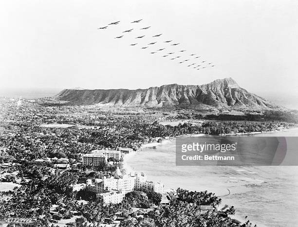 The White House announced that Japanese planes attacked Hawaii. Soon after as shown here, U. S. Medium bombers fly over diamond Head and beautiful...