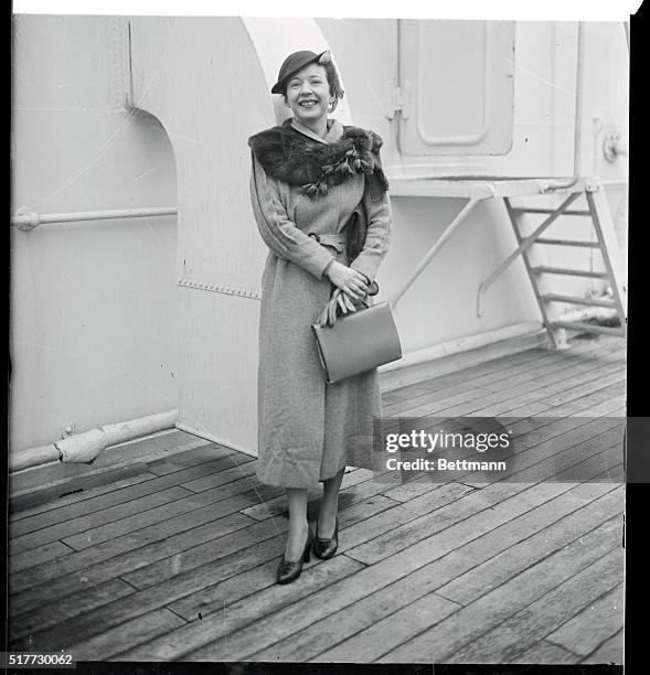 Miss Agnes de Mille, dancer, and niece of William B. De Mille, pictured as she arrived in New York City, aboard the S.S. Ile de France after a stay...