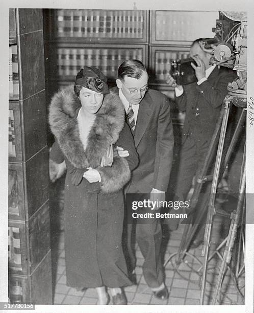 Mrs. Anne Morrow Lindbergh and Robert Peacock, Assistant Attorney General, pictured as they arrived at the Hunterdon County Courthouse at Flemington,...