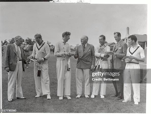 Winners of the North and South doubles championship are shown receiving their trophies from members of the U.S. Davis Cup selection committee at the...