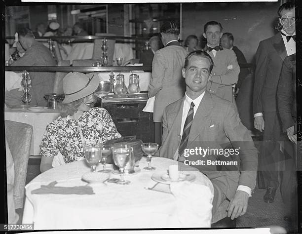 Ginger Rogers, popular motion picture actress, and Howard Hughes, millionaire aviator, snapped as they spent an evening together at the Rainbow Room,...