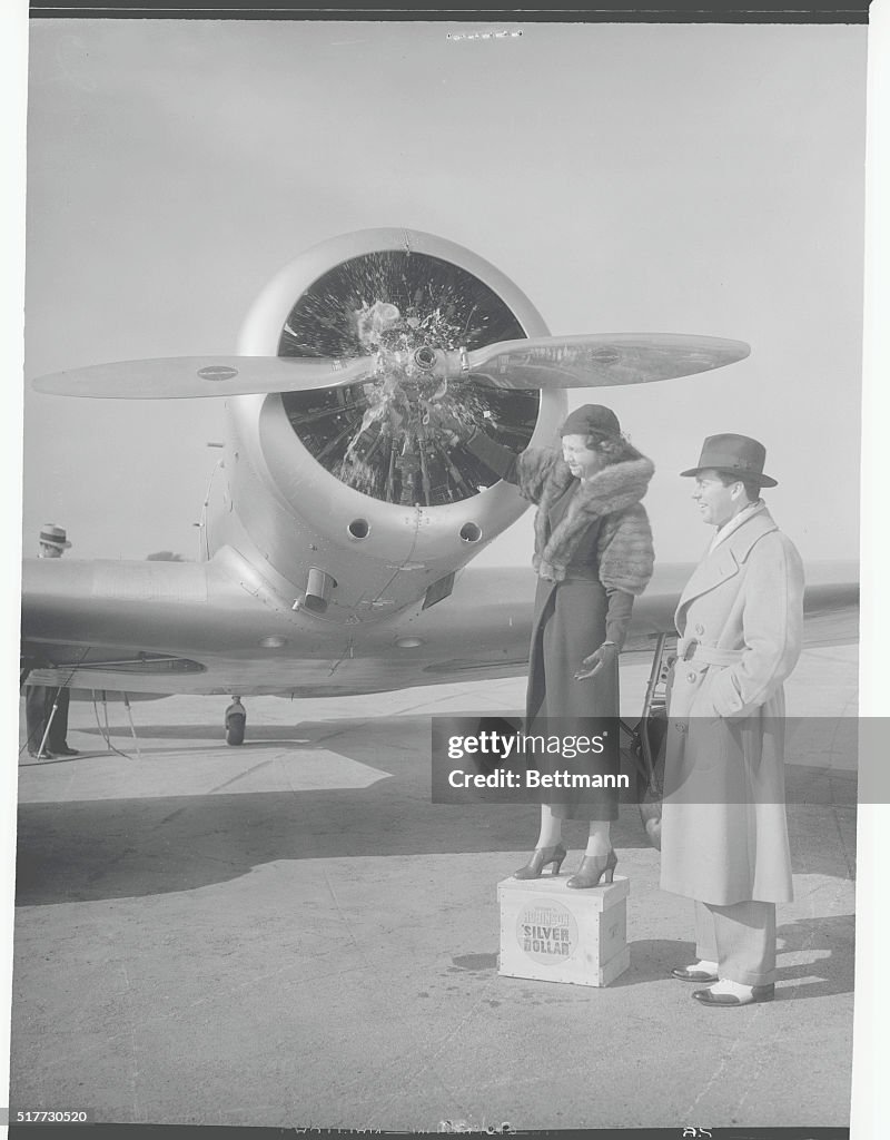 Man and Woman Standing Near Airplane