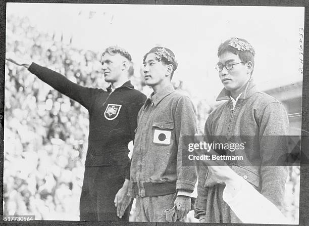 Olympics. 200 Meter Breast Stroke winners, left to right: Sietas, of Germany, gives heil salute; Hamuro of Japan; Koike of Japan.