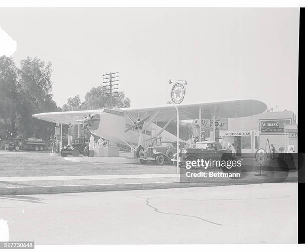 The airplane, Royal Albatross, converted to a gas station in Studio City, California. Its wings shelter the customers in their autos while an office...