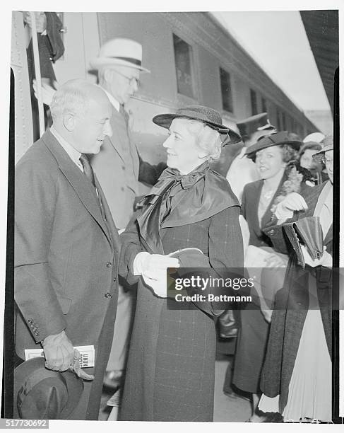 Mrs. Cecil B. DeMille says good bye to her famous husband as he prepares to board a streamline train for the Paramount convention in Chicago, where...