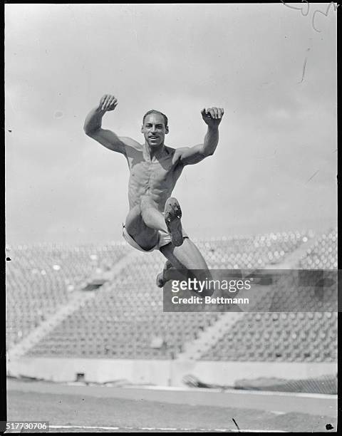 Seeking Olympic Berth. Edward Gordon, broad jumper, seeking a place on the U.S. Olympic Team, shown at Randall's Island, where he practiced for the...