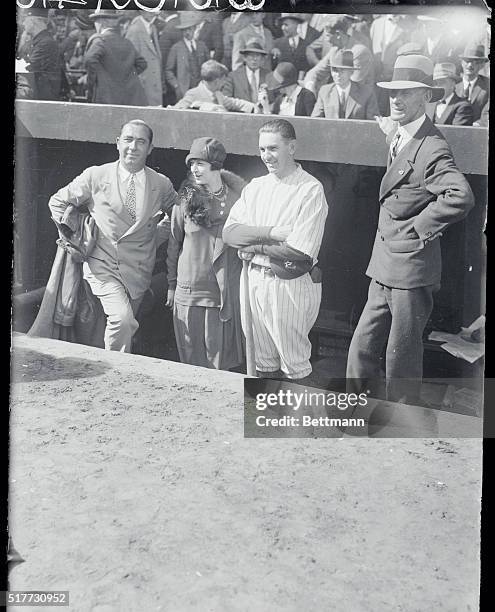 Photo shows Mr. And Mrs. Walter Hagen wishing luck to Rogers Hornsby before 2nd World Series game. Hagen is a pro golf champ.