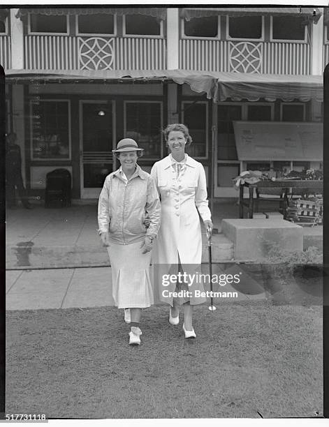 Patty Berg of Minneapolis, and Lucille Robinson of Chicago, are shown above, left to right, at the Women's Western Golf Tournament, being held at the...