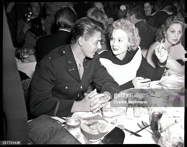 Hollywood, CA: Lietenant Ronald Reagan sits with Jane Wyman at the California State Guard Military Ball being held at the Palladium.