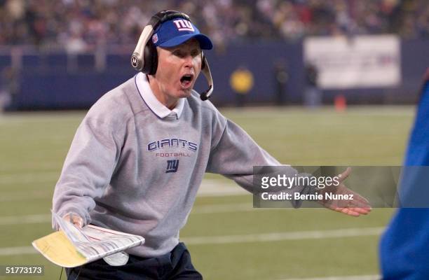Head coach Tom Coughlin of the New York Giants reacts to a call of roughing the passer in the fourth quarter in a game against the Atlanta Falcons at...
