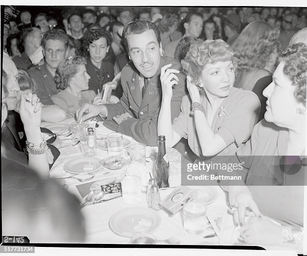 California State Guard Military Ball, held at the Palladium. Cesar Romero, and Claudette Colbert attend the ball.